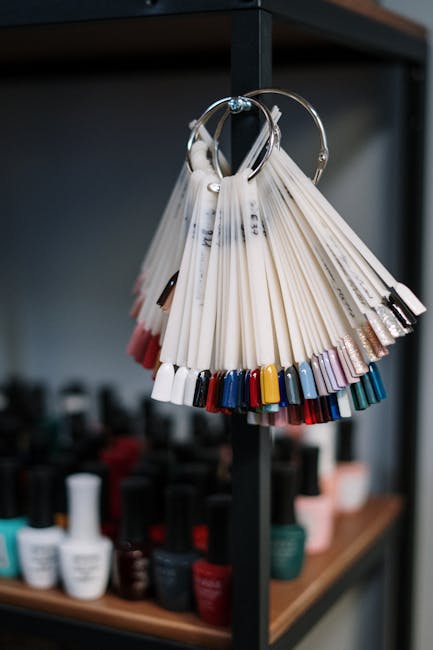 Nail polish samples displayed in a beauty salon, showcasing a vibrant color palette for manicure choices.